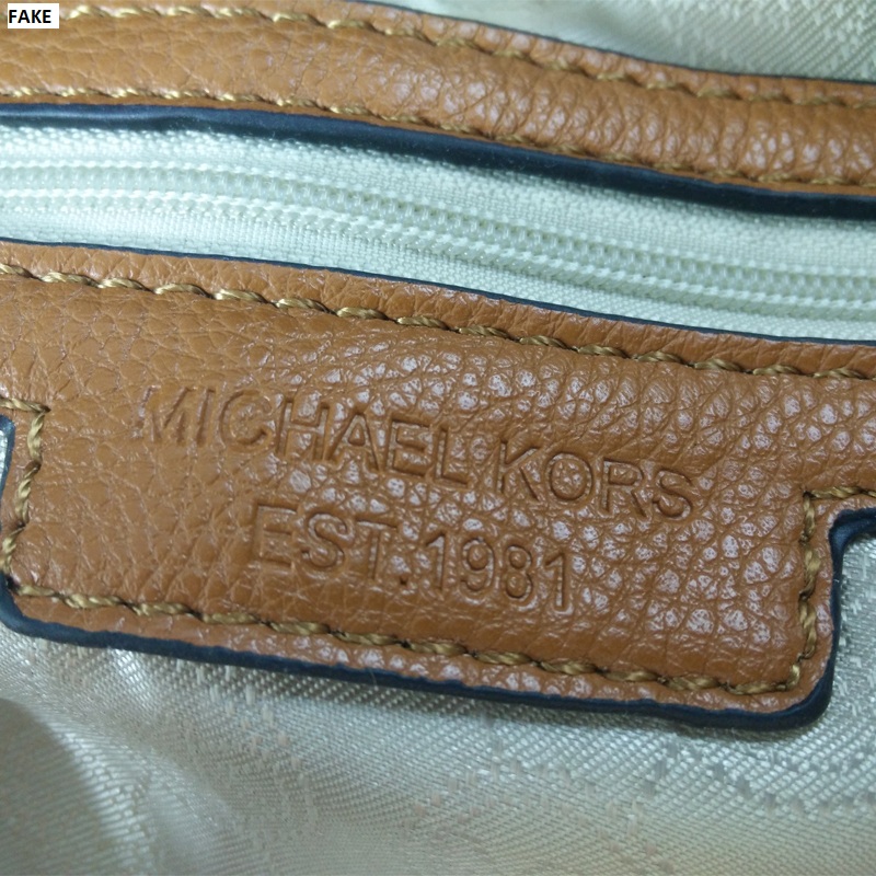 does michael kors use real leather